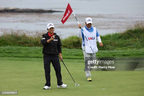 Haru Nomura of Japan reacts after making birdie on the fourth green during the first round of the 78th U.S. Women's Open at Pebble Beach Golf Links...