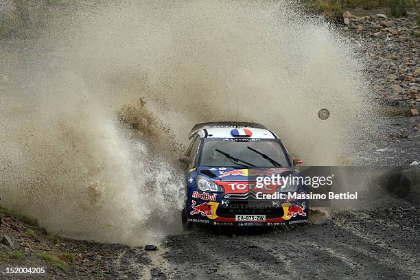 Sebastien Loeb of France and Daniel Elena of Monaco compete in their Citroen Total WRT Citroen DS3 WRC during Day One of the WRC Wales Rally GB on...