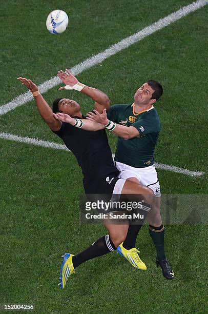 Julian Savea of the All Blacks and Morne Steyn of the South Africa contest for the high ball during the Rugby Championship match between the New...