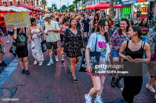 People are seen shouting slogans against "catcalling" during the demonstration. A rally called 'Witches Night' was held in Nijmegen against...