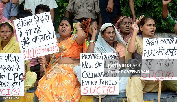 Socialist Unity Centre of India-Communist activists shout anti-Congress government slogans during a protest in New Delhi on September 15 against...