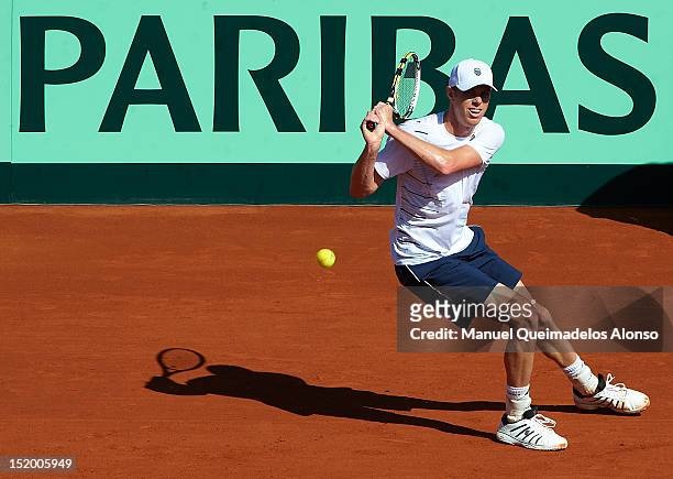 Sam Querrey of the United States returns a shot to David Ferrer of Spain during day one of the semi final Davis Cup between Spain and the United...