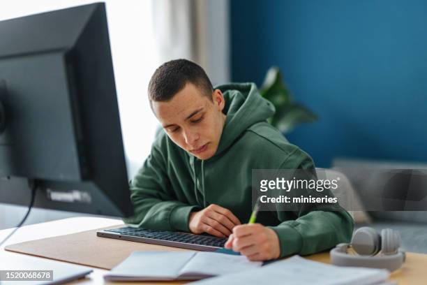 portrait of a young man learning from home - copy writing bildbanksfoton och bilder