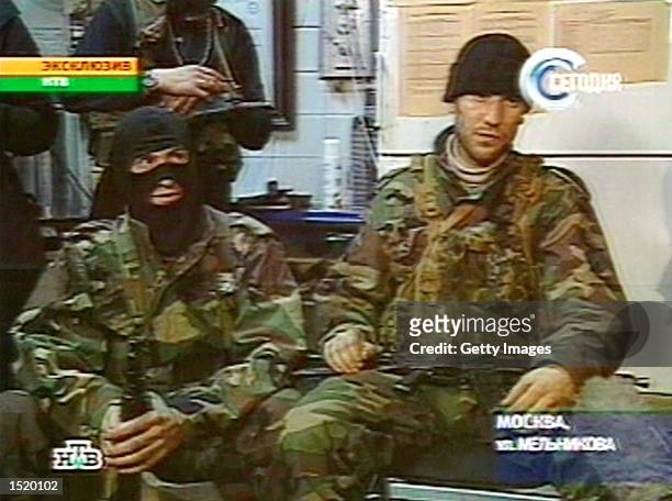 Chechen separatists holding about 600 hostages at a Moscow theater speak to a Russian Television crew on October 25, 2002 in Moscow, Russia. Members...