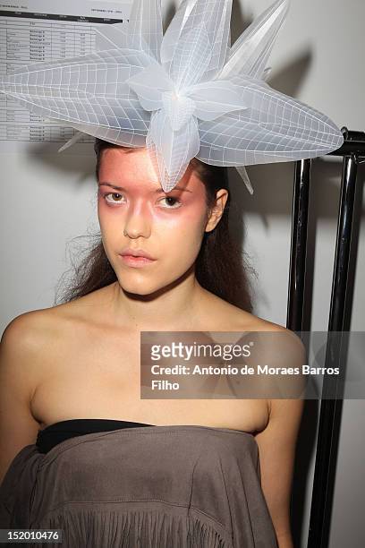 Model prepares backstage ahead of the Corrie Nielsen show on day 1 of London Fashion Week Spring/Summer 2013, at the Courtyard Show Space on...