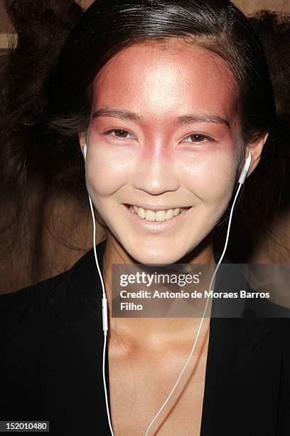 Model prepares backstage ahead of the Corrie Nielsen show on day 1 of London Fashion Week Spring/Summer 2013, at the Courtyard Show Space on...