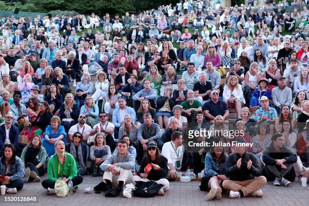 Spectators watch the Men's Singles second round match between Andy Murray of Great Britain and Stefanos Tsitsipas of Greece on The Hill during day...