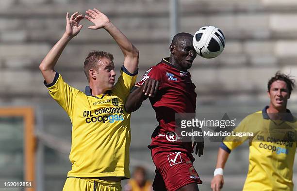Daniel Adejo of Reggina competes for the ball in air with Simone Stanco of Modena during the Serie B match between Reggina Calcio and FC Modena at...