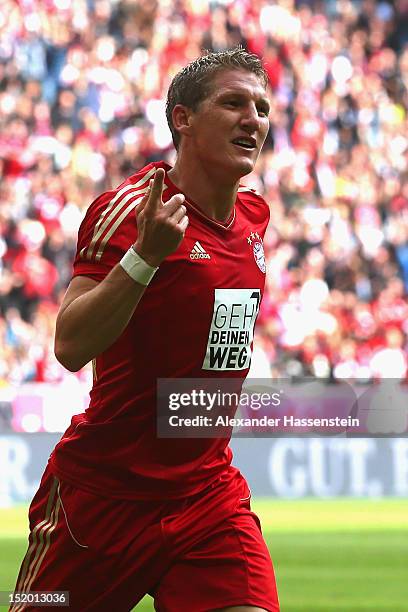 Bastian Schweinsteiger of Muenchen celebrates scoring the second team goal during the Bundesliga match between FC Bayern Muenchen and 1. FSV Mainz 05...