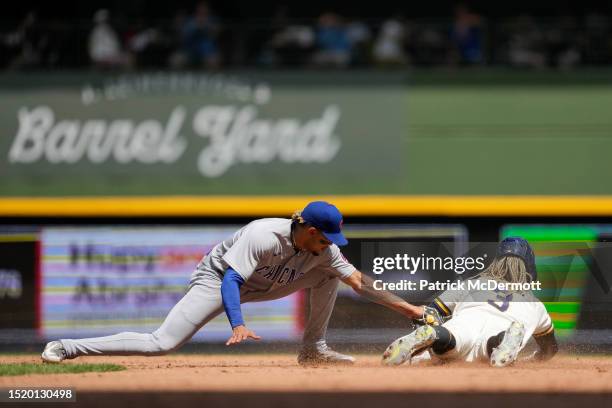 Raimel Tapia of the Milwaukee Brewers steals second base against Christopher Morel of the Chicago Cubs in the fifth inning at American Family Field...