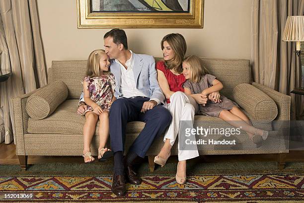In this handout photo provided by the Royal Press Department, Princess Letizia of Spain, Prince Felipe of Spain and their children, Princesses Leonor...
