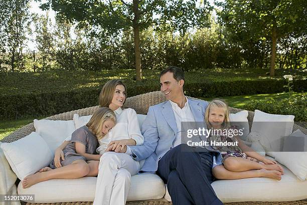 In this handout photo provided by the Royal Press Department, Princess Letizia of Spain, Prince Felipe of Spain and their children, Princesses Leonor...