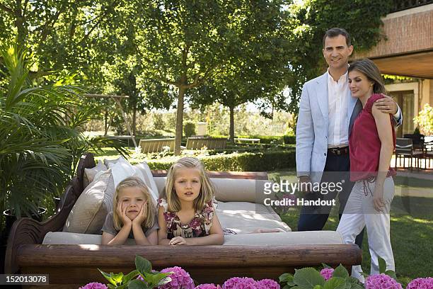 In this handout photo provided by the Royal Press Department, Princess Letizia of Spain, Prince Felipe of Spain and their children, Princesses Leonor...
