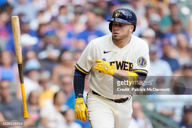Victor Caratini of the Milwaukee Brewers tosses his bat after taking a walk against the Chicago Cubs in the fifth inning at American Family Field on...