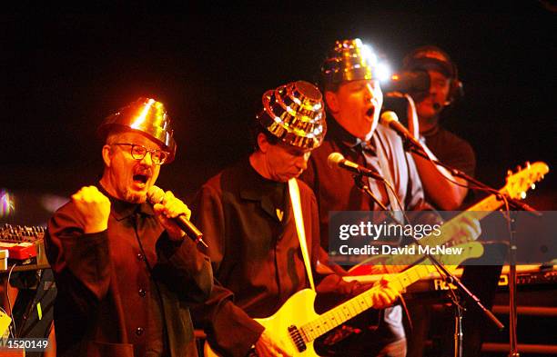 The rock band Devo performs under colored stage lights at Tony Hawk's Boom Boom Huck Jam show on October 24, 2002 in San Diego, California. The Huck...