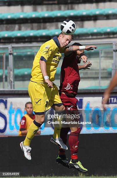 Simone Rizzato of Reggina competes for the ball in air with Francesco Stanco of Modena during the Serie B match between Reggina Calcio and FC Modena...