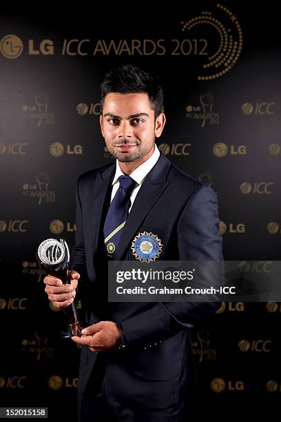 Virat Kohli of India, winner of the ICC ODI Cricketer of the Year 2012 award poses with his trophy at the LG ICC Awards ceremony on September 15,...