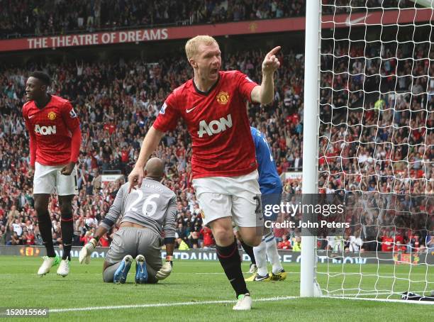 Paul Scholes of Manchester United celebrates scoring their first goal during the Barclays Premier League match between Manchester United and Wigan...