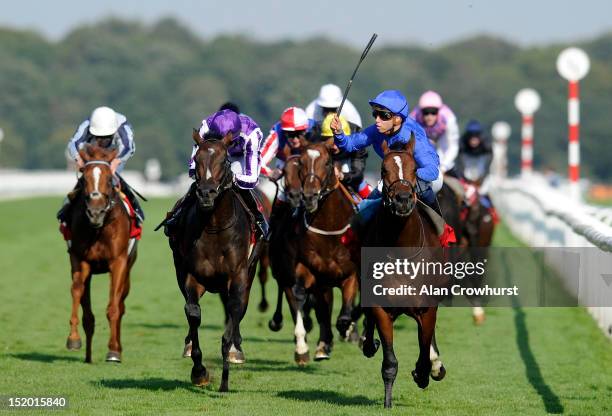 Mickael Barzalona riding Encke win The Ladbrokes St. Leger Stakes from Camelot at Doncaster racecourse on September 15, 2012 in Doncaster, England.