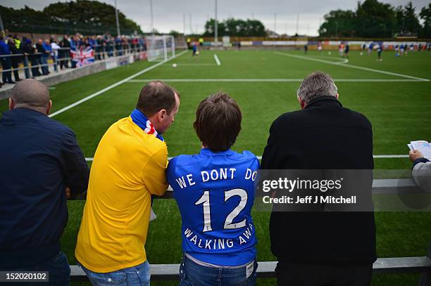 Fans of Rangers attend the Irn Bru Scottish Third Division match between Annan Athletic FC and Rangers at Galabank Stadium on September 15, 2012 in...