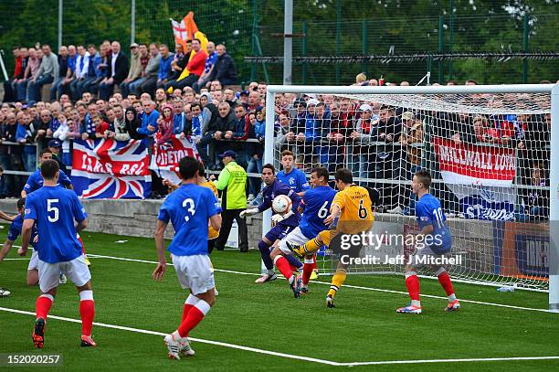 Scott Chaplain of Annan Athletic FC is blocked by Lee McCulloch and Neil Alexander of Rangers during the Irn Bru Scottish Third Division match...