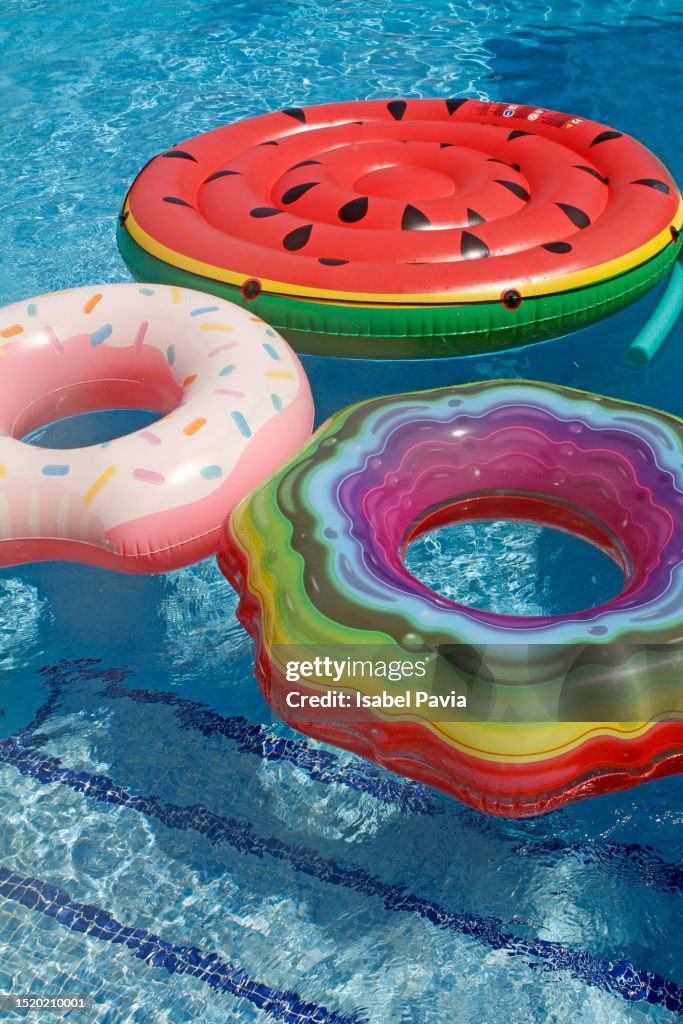 Inflatable swim rings floating at swimming pool