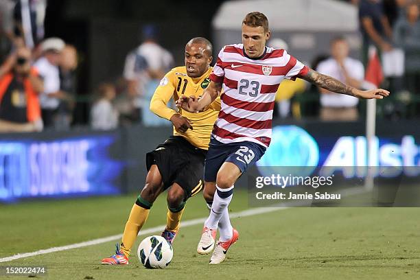 Dane Richards of the Jamaican National Team and Fabian Johnson of the U.S. National Team battle for control of the ball on September 11, 2012 at Crew...