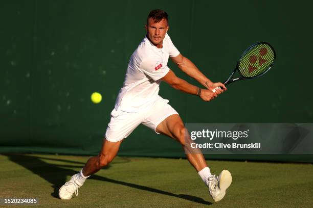 Marton Fucsovics of Hungary plays a backhand against Marcos Giron of United States in the Men's Singles second round match during day four of The...