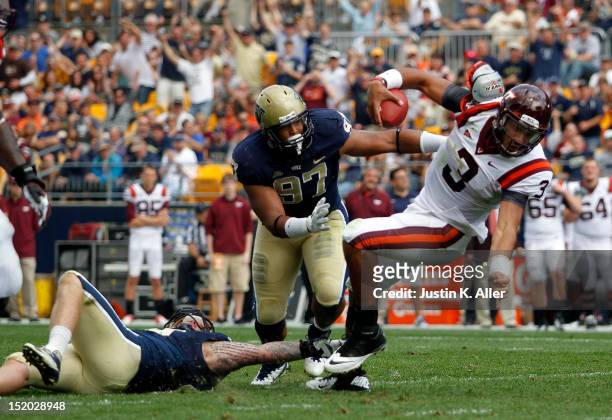 Logan Thomas of the Virginia Tech Hokies is sacked by Bryan Murphy and Aaron Donald of the Pittsburgh Panthers during the game on September 15, 2012...