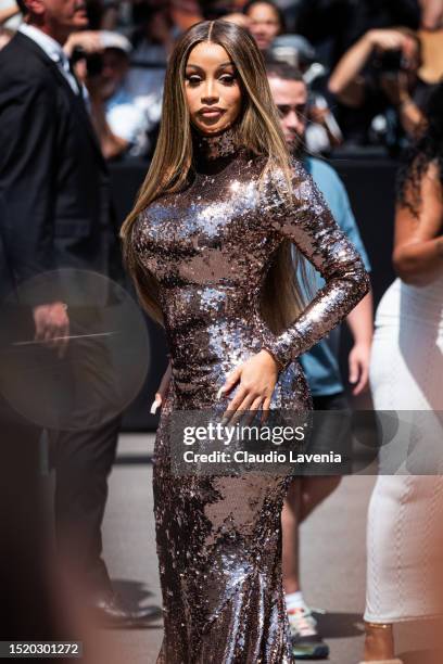 Cardi B wears a long sleeves bronze sequins dress, outside Fendi, during the Haute Couture Fall/Winter 2023/2024 as part of Paris Fashion Week on...