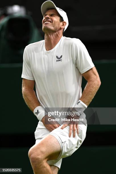 Andy Murray of Great Britain appears to be injured against Stefanos Tsitsipas of Greece in the Men's Singles second round match during day four of...