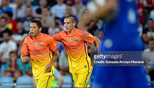 Adriano Correia Claro of FC Barcelona celebrates his first goal with his teammate Tello during the La Liga match between Getafe CF and FC Barcelona...