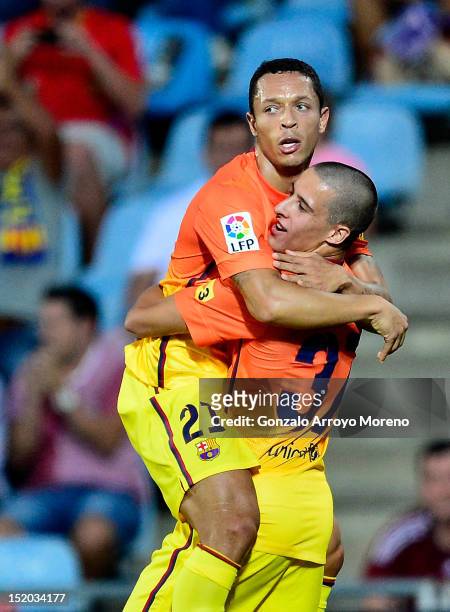 Adriano Correia Claro of FC Barcelona celebrates his first goal with his teammate Tello during the La Liga match between Getafe CF and FC Barcelona...