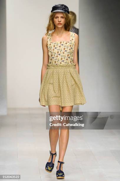 Model walks the runway at the Kinder Aggugini Spring Summer 2013 fashion show during London Fashion Week on September 15, 2012 in London, United...