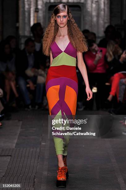 Model walks the runway at the Moschino Cheap & Chic Spring Summer 2013 fashion show during London Fashion Week on September 15, 2012 in London,...