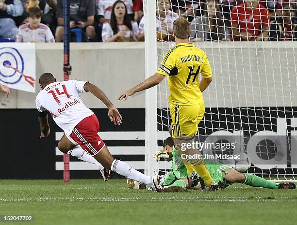 Thierry Henry of the New York Red Bulls scores a goal in the first half past Andy Gruenebaum of the Columbus Crew at Red Bull Arena on September 15,...