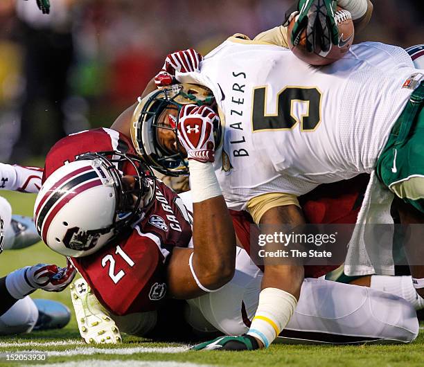 South Carolina safety DeVonte Holloman tackles Alabama-Birmingham running back Darrin Reaves during the first quarter at Williams-Brice Stadium in...