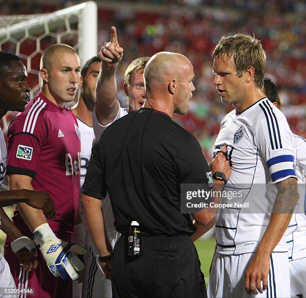 Jay DeMerit of the Vancouver Whitecaps FC argues with an official over a penalty call against the FC Dallas on September 15, 2012 at FC Dallas...