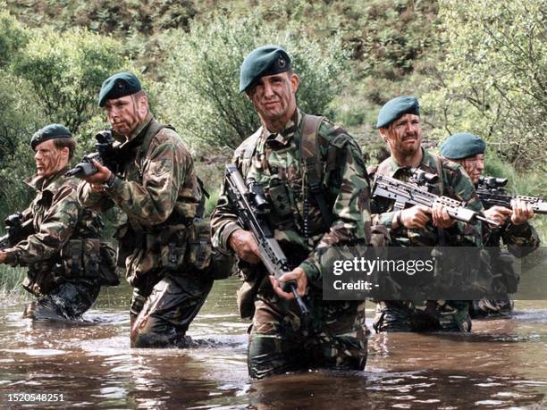 An undated file picture shows British royal marines in water during a training session at an unspecified location. US warplanes and cruise missiles...