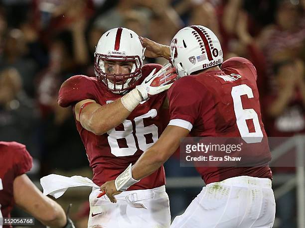 Zach Ertz and Josh Nunes of the Stanford Cardinal celebrate after Nunes threw the winning touchdown pass to Ertz during their game against the USC...