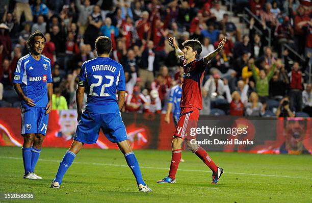 Alvaro Fernandez of the Chicago Fire scores a goal in front of Alessandro Nesta of Montreal Impact and Davy Arnaud in an MLS match on September 15,...