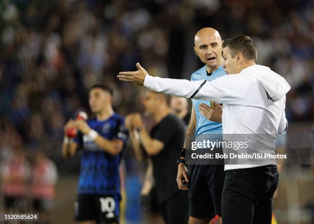 Galaxy head coach and sporting director Greg Vanney questions a call with Fourth Official Sergii Demianchuk during a game between Los Angeles Galaxy...