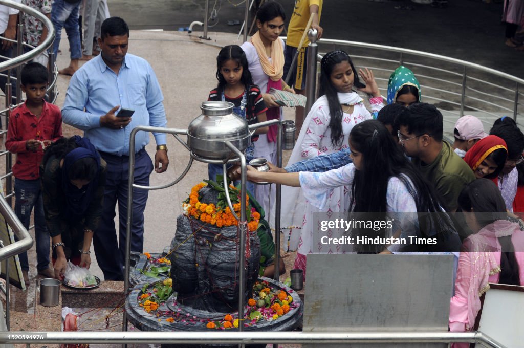 Devotees perform rituals for the Hindu God Shiva holy month on the ...