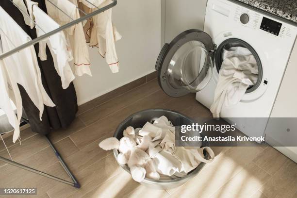 washing cycle preparation at home. - drying stockfoto's en -beelden