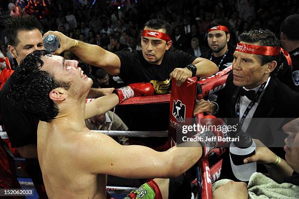 Julio Cesar Chavez Jr. And Julio Cesar Chavez Sr. Await the decision in their corner after the fight against Sergio Martinez for their WBC...