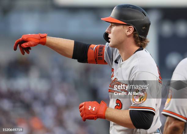Gunnar Henderson of the Baltimore Orioles reacts after driving in a run with a single against the New York Yankees in the third inning during their...