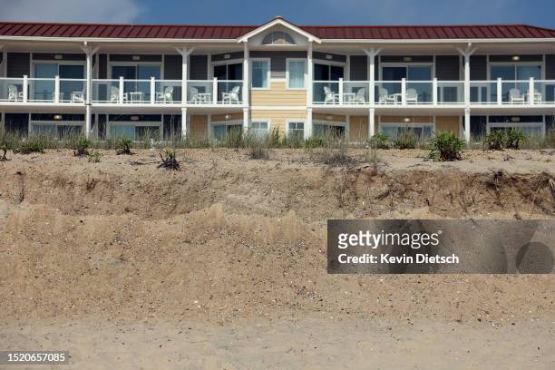 Damaged dunes are seen in front of a hotel as the Army Corp of Engineers work on a beach and dune replenishment project on July 06, 2023 in Bethany...