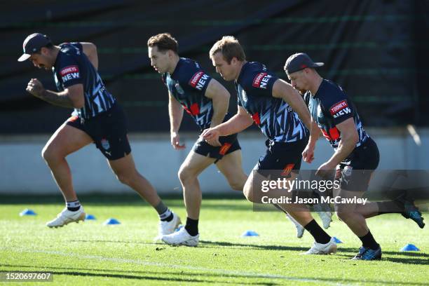 Damien Cook and Jake Trbojevic of the Blues run during a New South Wales Blues State of Origin Training Session at NSWRL Centre of Excellence on July...