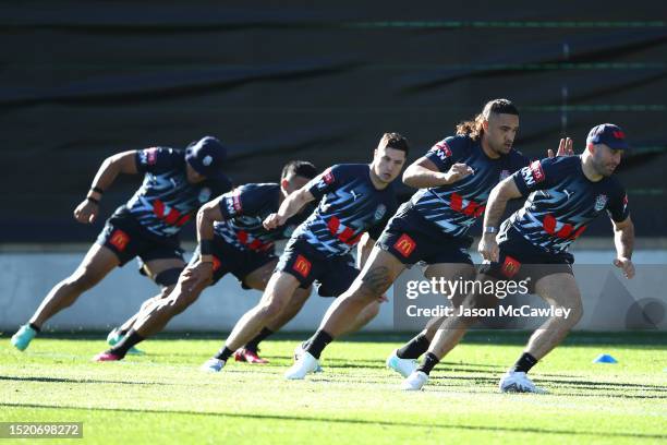 James Tedesco and Keaon Koloamatangi of the Blues run during a New South Wales Blues State of Origin Training Session at NSWRL Centre of Excellence...