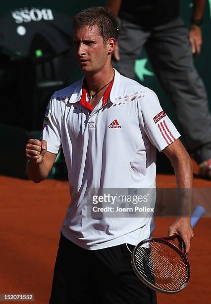 Florian Mayer of Germany celebrates during his match against Bernard Tomic of Australia during the Davis Cup World Group Play-Off match between...